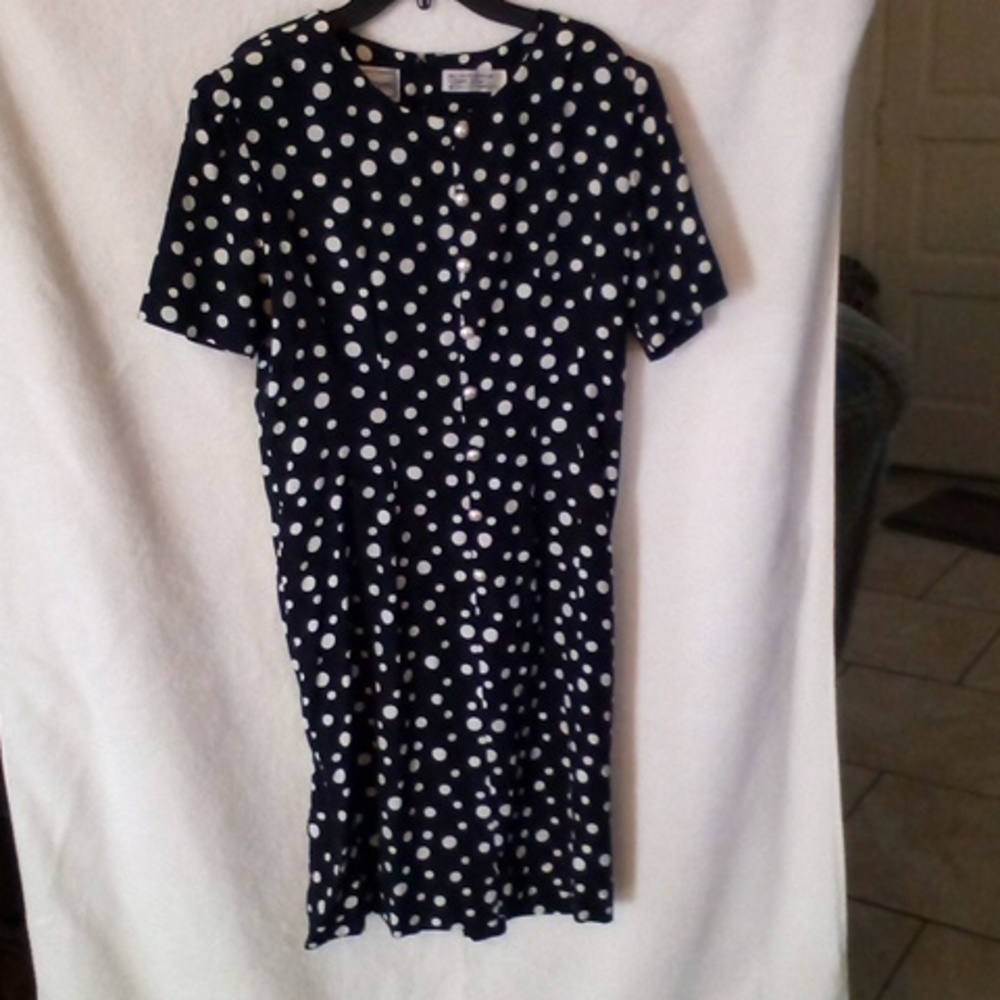 Navy blue with white polka dots and pearl like buttons on front dress.